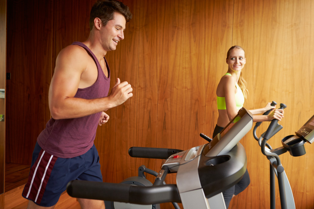 couple using a treadmill