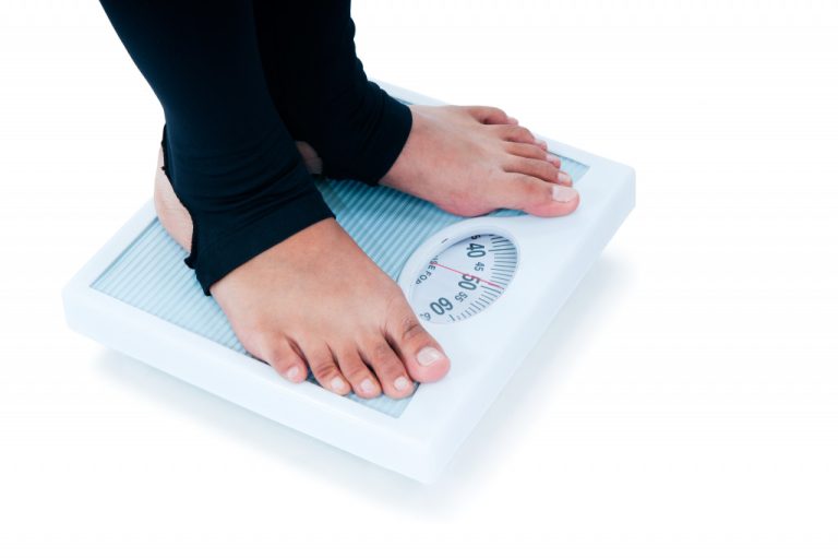person on a weighing scale