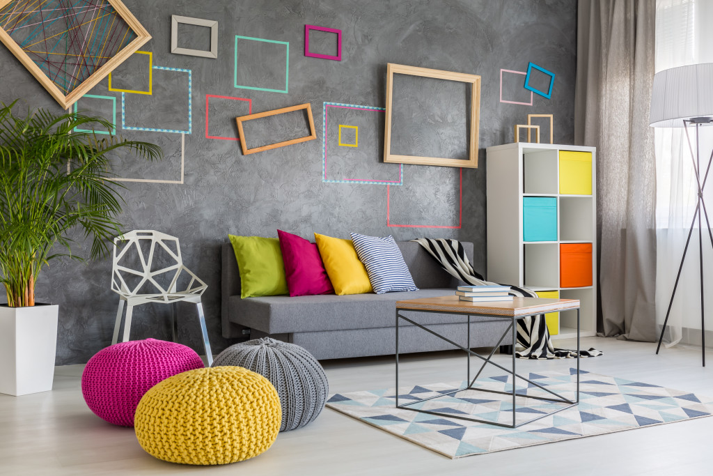 A living room with a colorful design and unique furniture