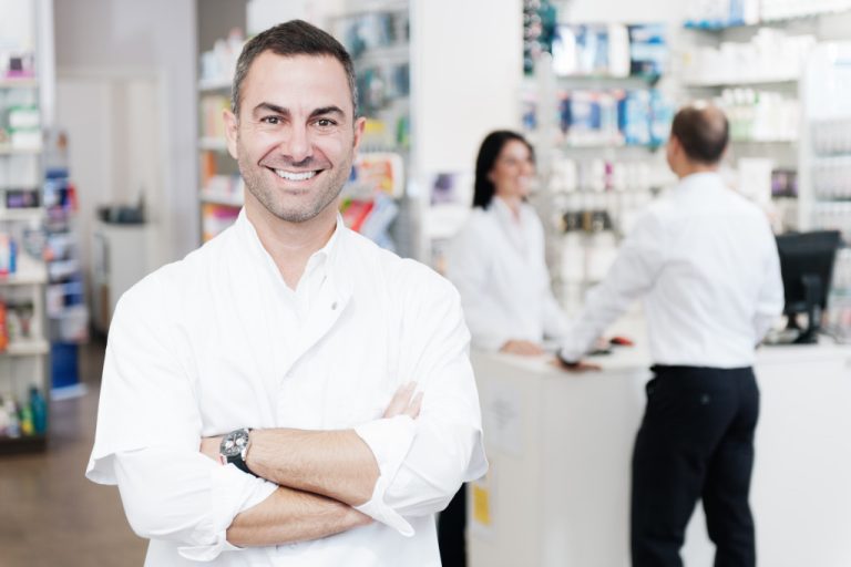 a portrait of a man at a pharmaceutical store