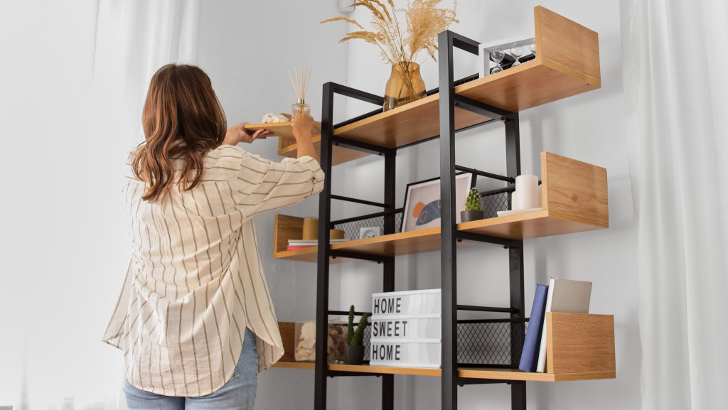 a woman fixing the shelves