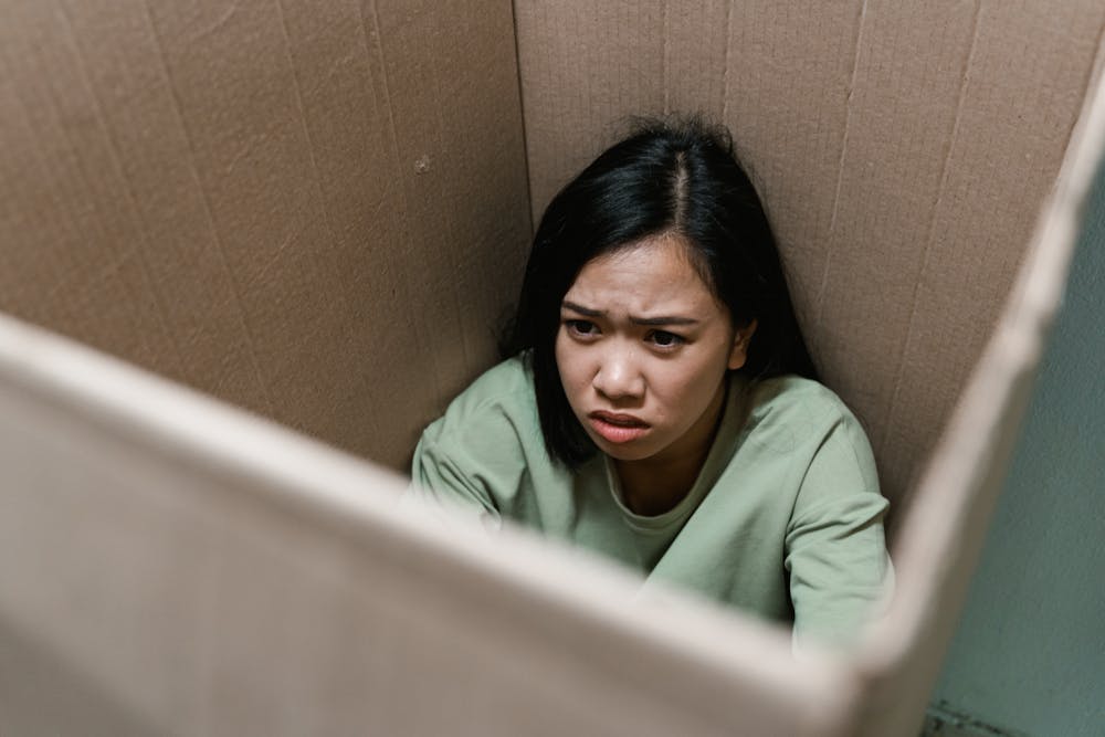 a woman stuck inside a box